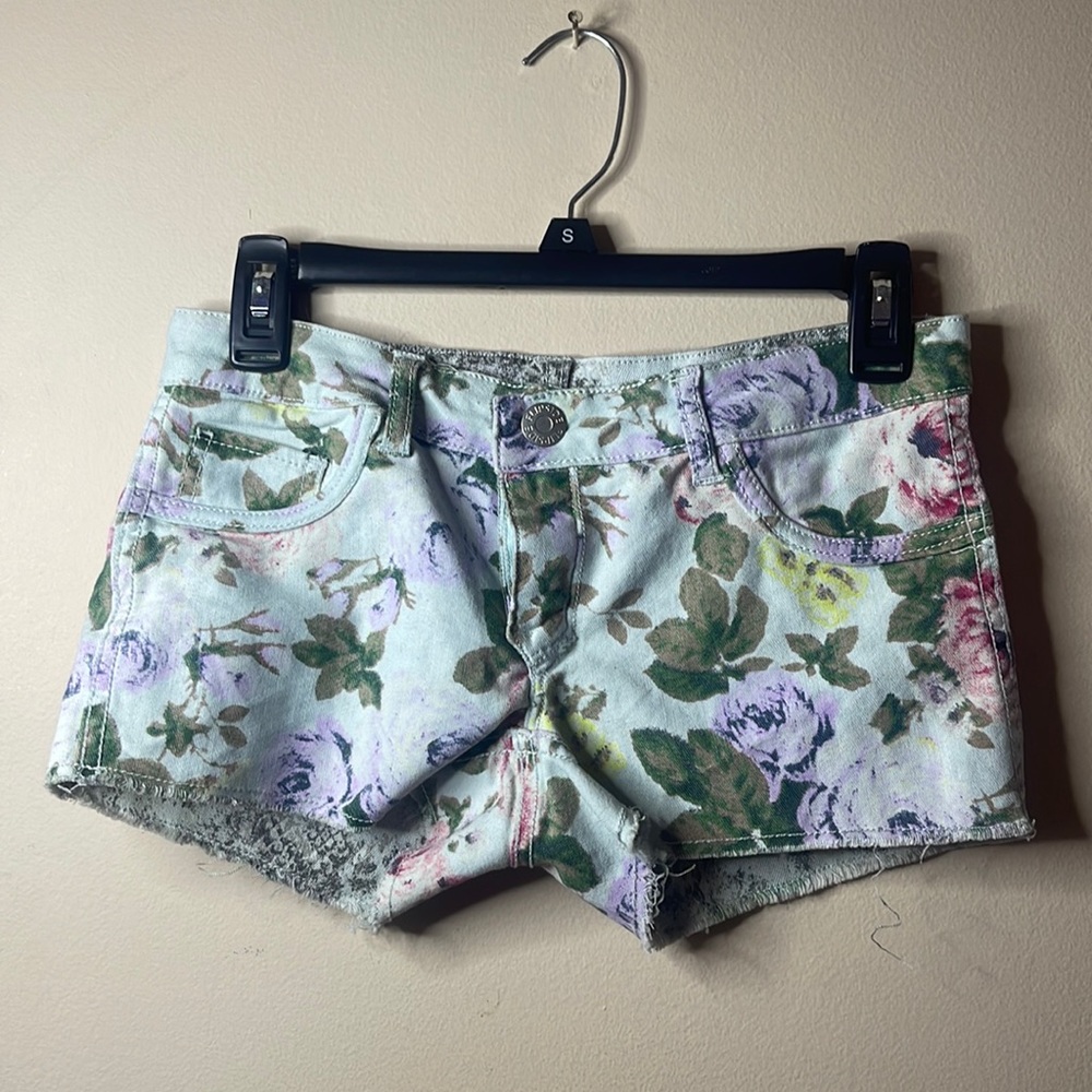 Reverse-able shorts one side is flowers, other side is ashy color. Size 1.